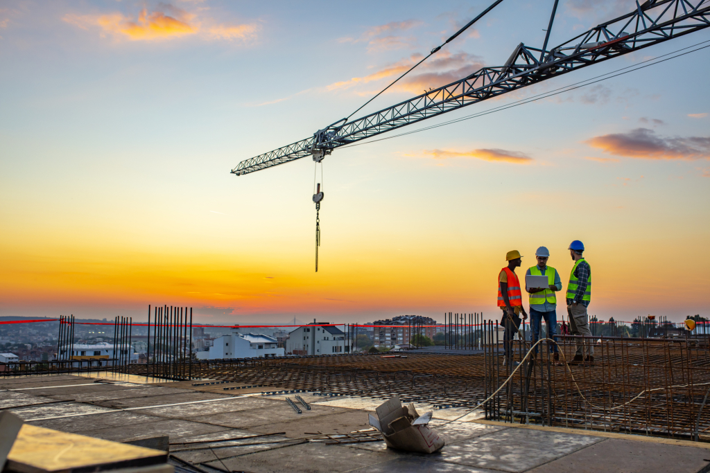 photo of construction site at dusk with crane