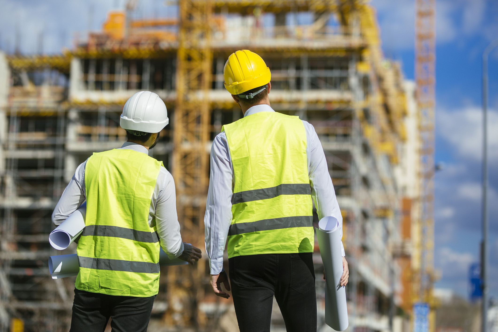 Image of a builder and developer looking at a project together